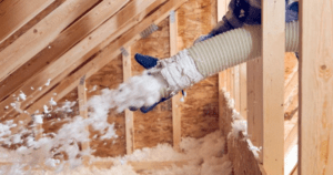 Insulation being placed in home