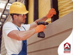 Construction Worker Installing Siding