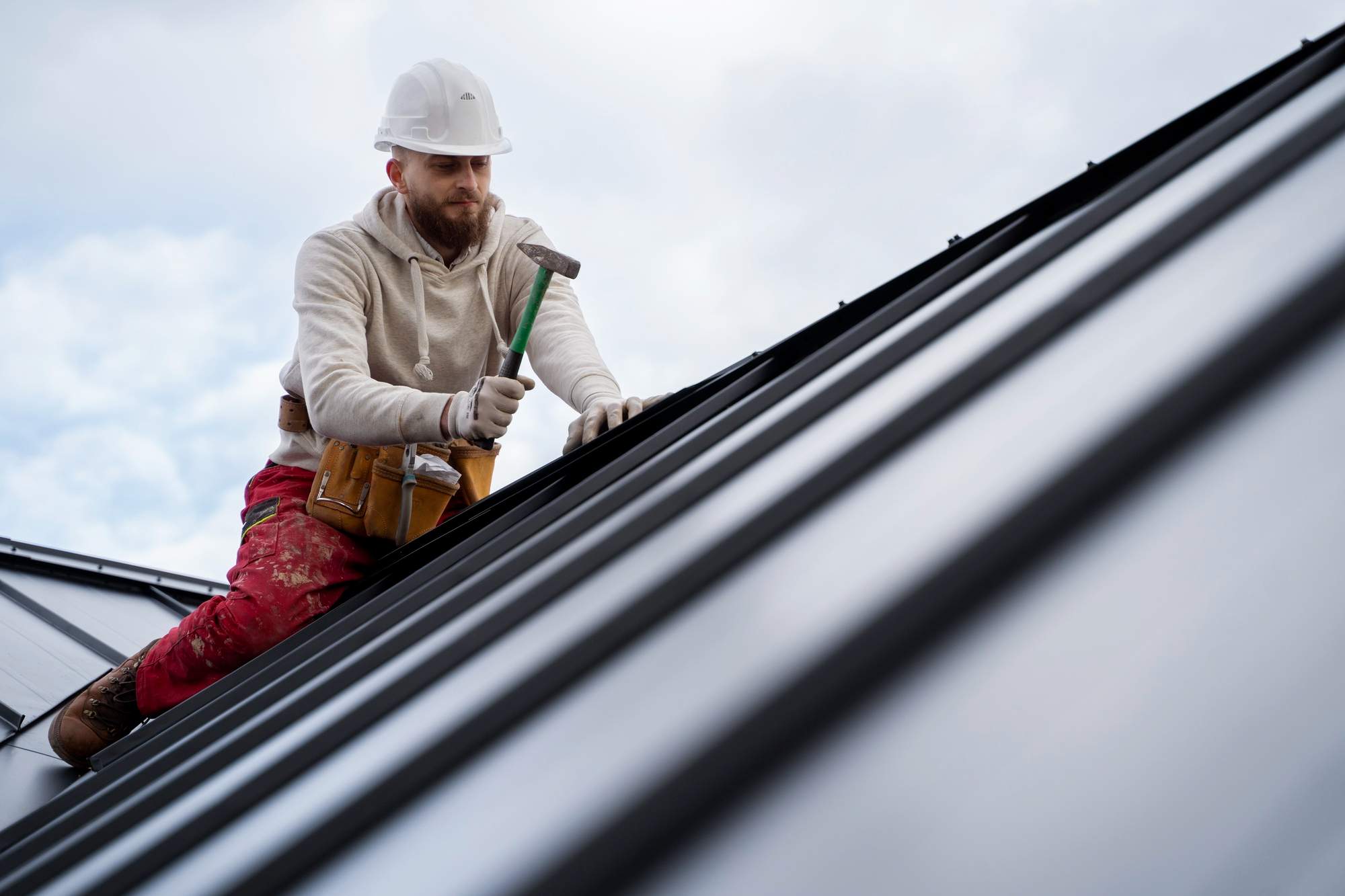 working on Metal Roofing