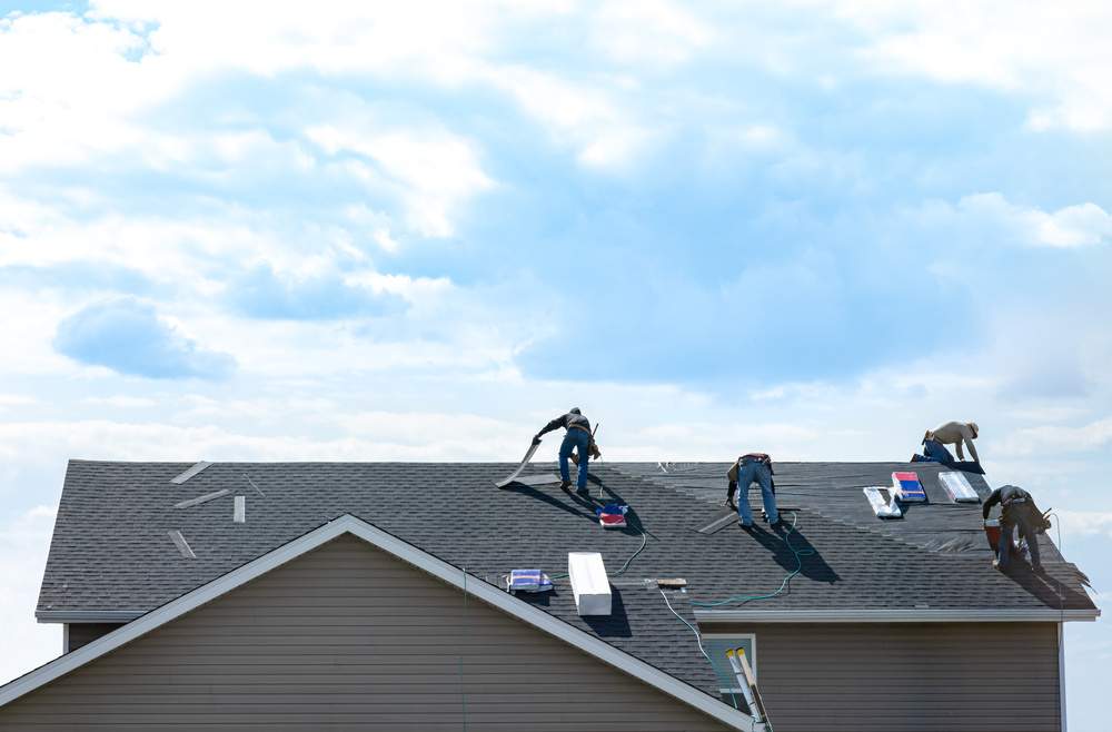 worker working on roof installation