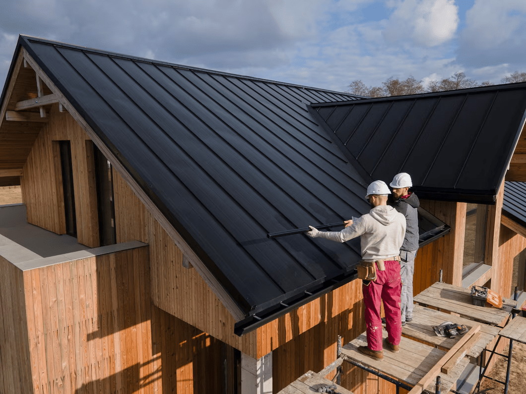 worker installing roof