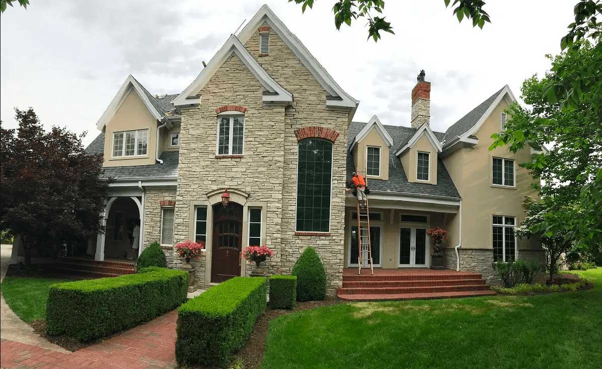 Elegant Home Exterior with Worker