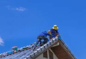 worker repairing roof