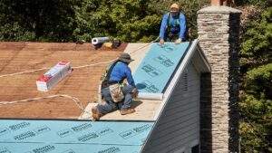 Roofers installing a FORTIFIED Roof