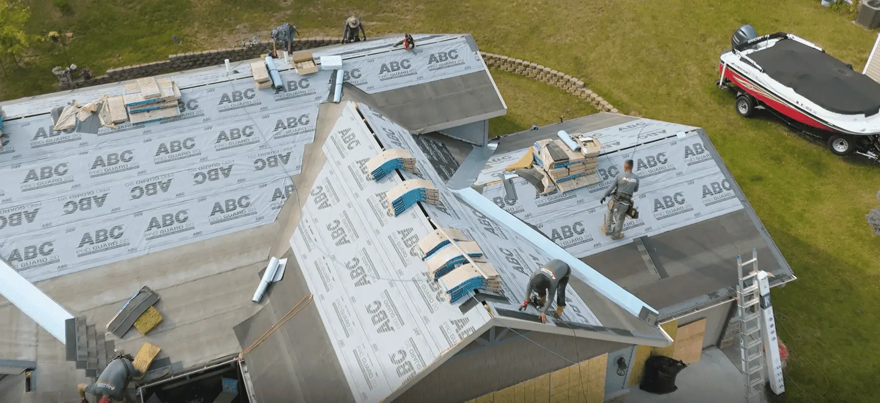 worker installing roof